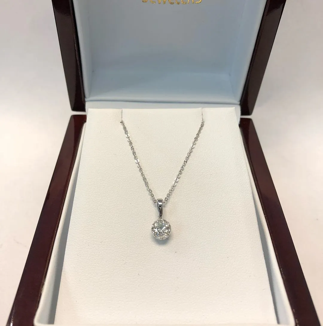 Round diamond solitaire pendant in a Goss Company Jewelers box