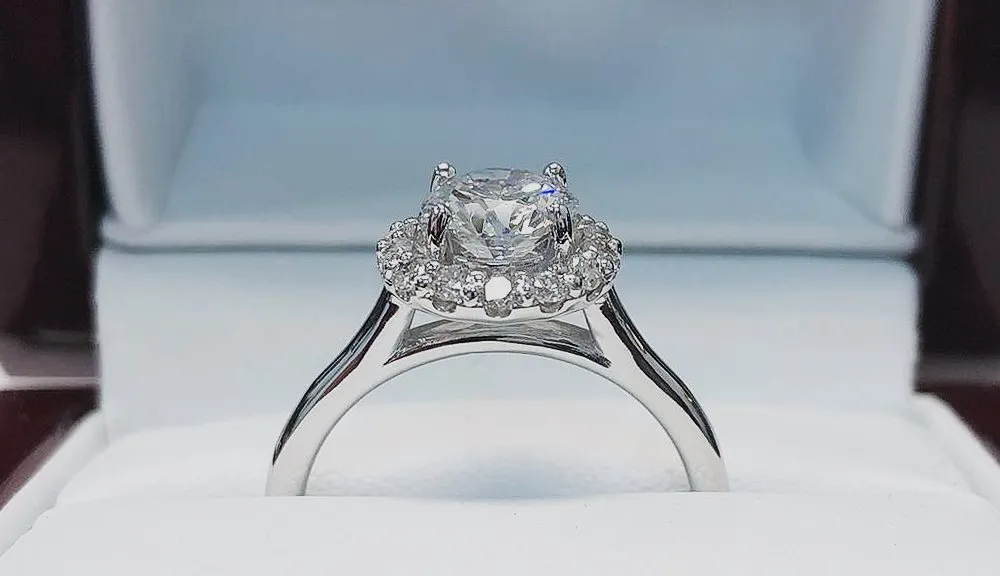 Halo diamond engagement ring in a presentation box