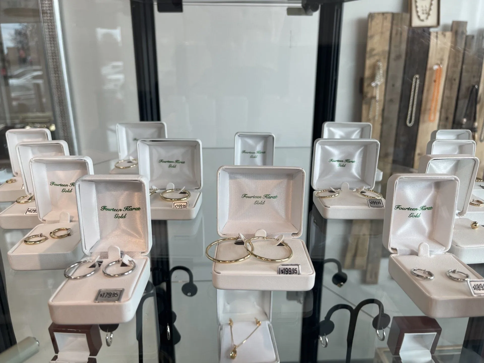 Diamond stud earrings and a diamond circle pendant in Goss branded boxes